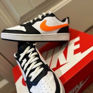 Nike Sneakers with Orange Swoosh and Black Accents